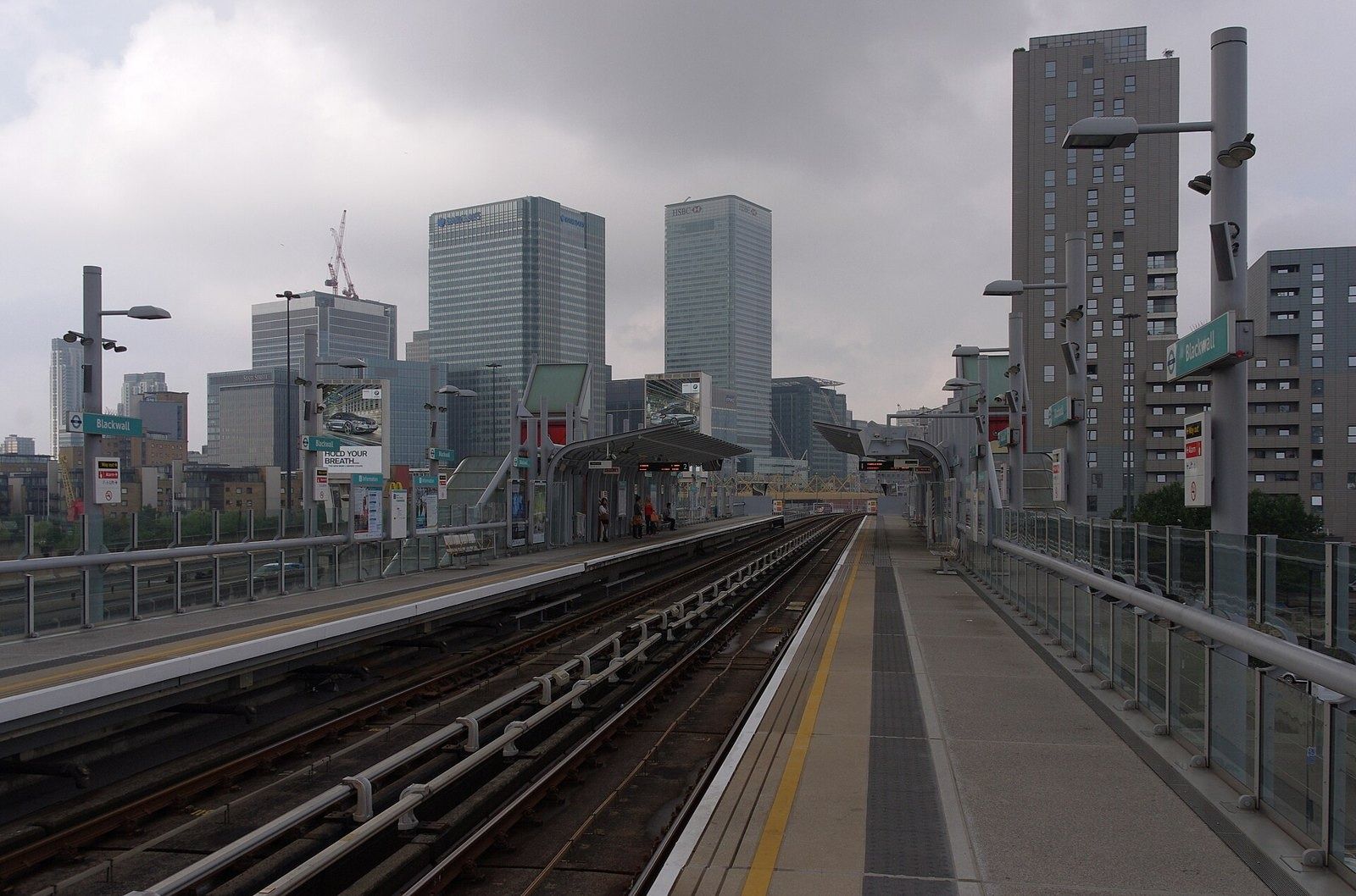 Barclays: Distant office towers seen along an elevated railway platform