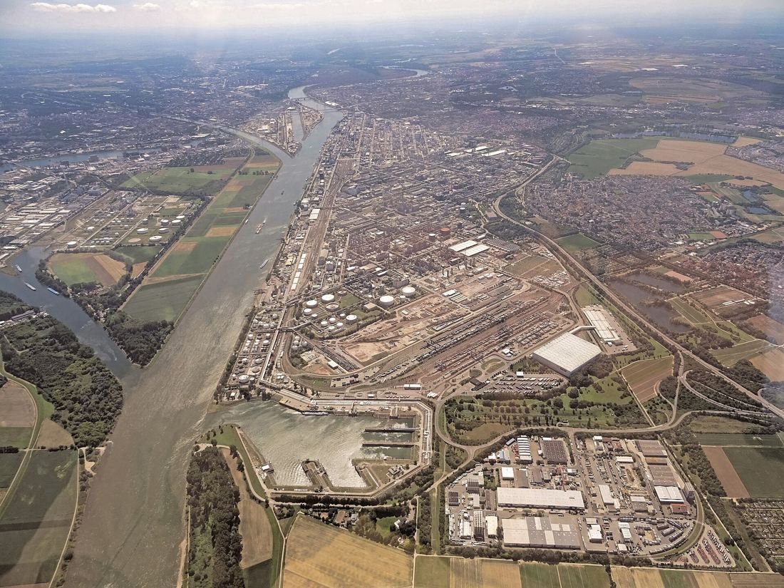 Aerial view of a huge industrial site along a river