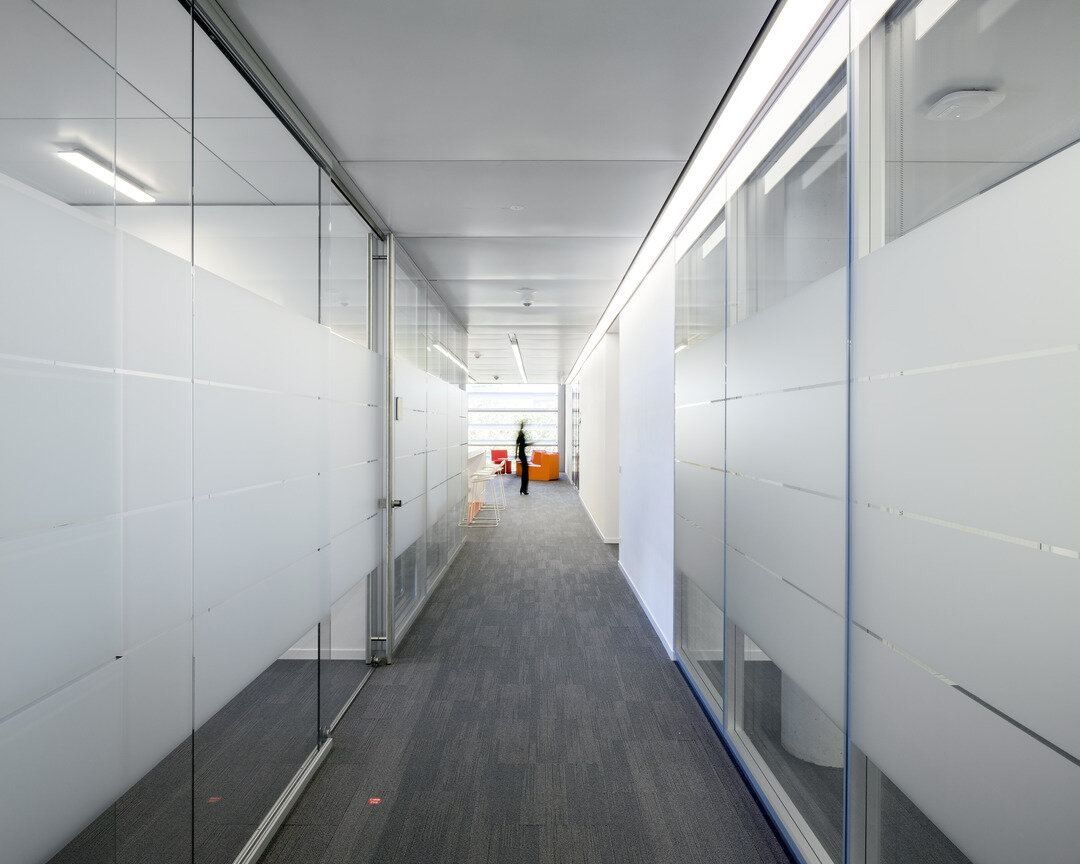 Long corridor lined with frosted glass walls