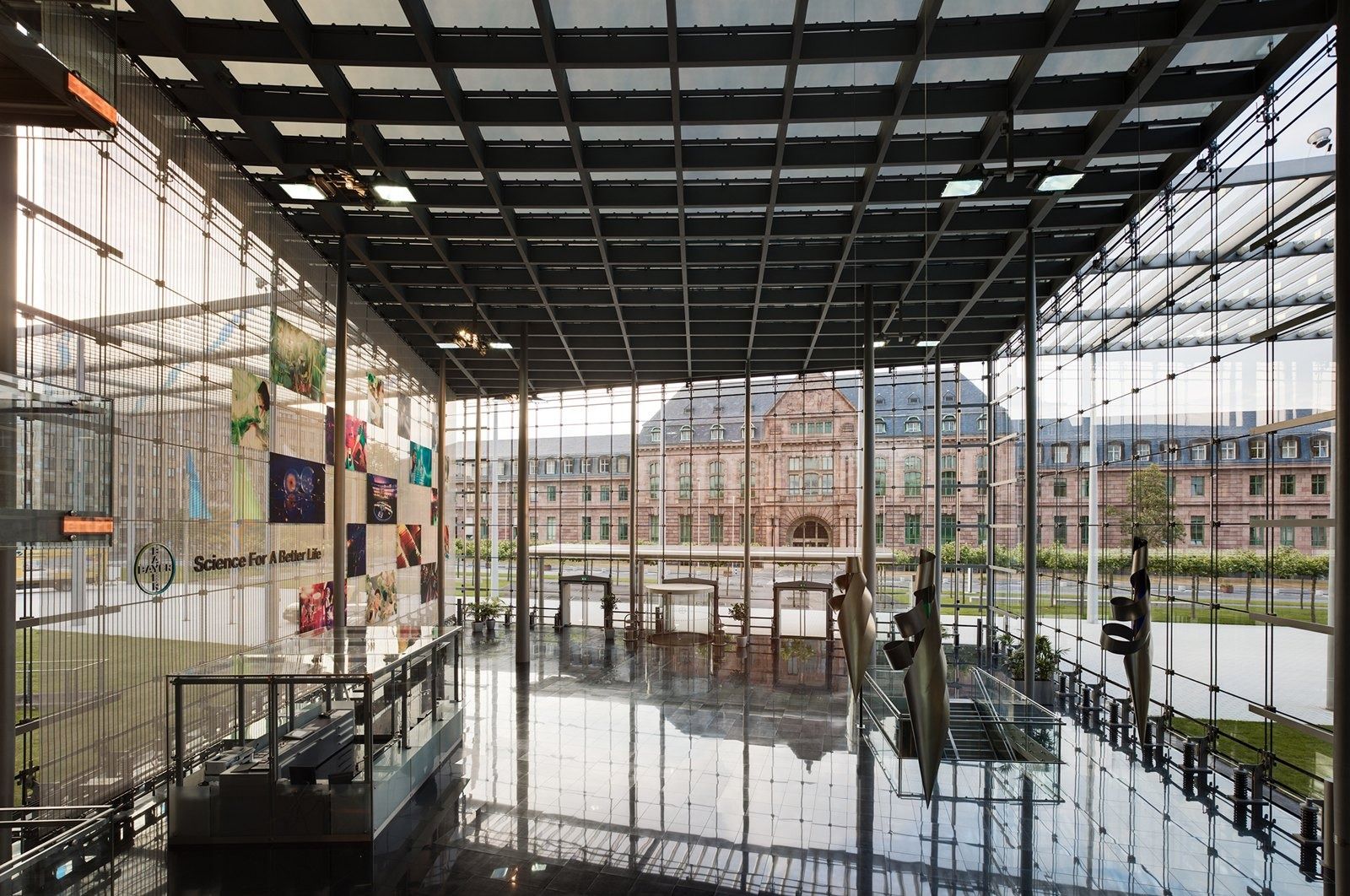 Bayer: Tall glass entrance hall with a colourful artwork