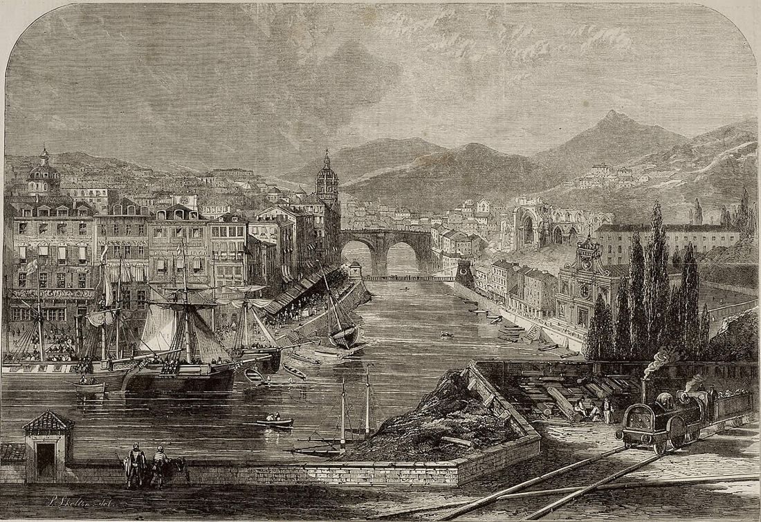 Engraving of a river city with boats, a stone bridge and hills behind