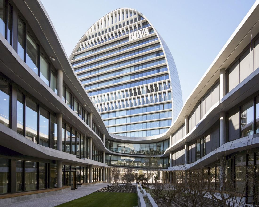 BBVA: Oval tower framed by two curving three-storey office wings around a planted courtyard