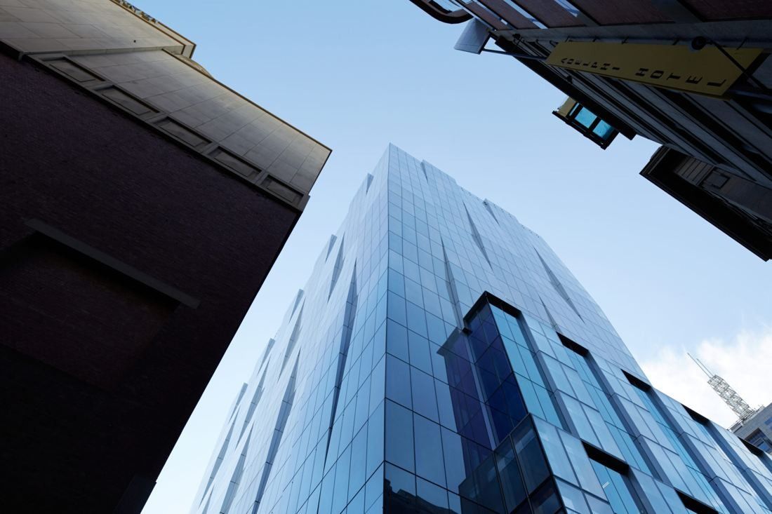 BHP: Faceted glass facade seen steeply from street level