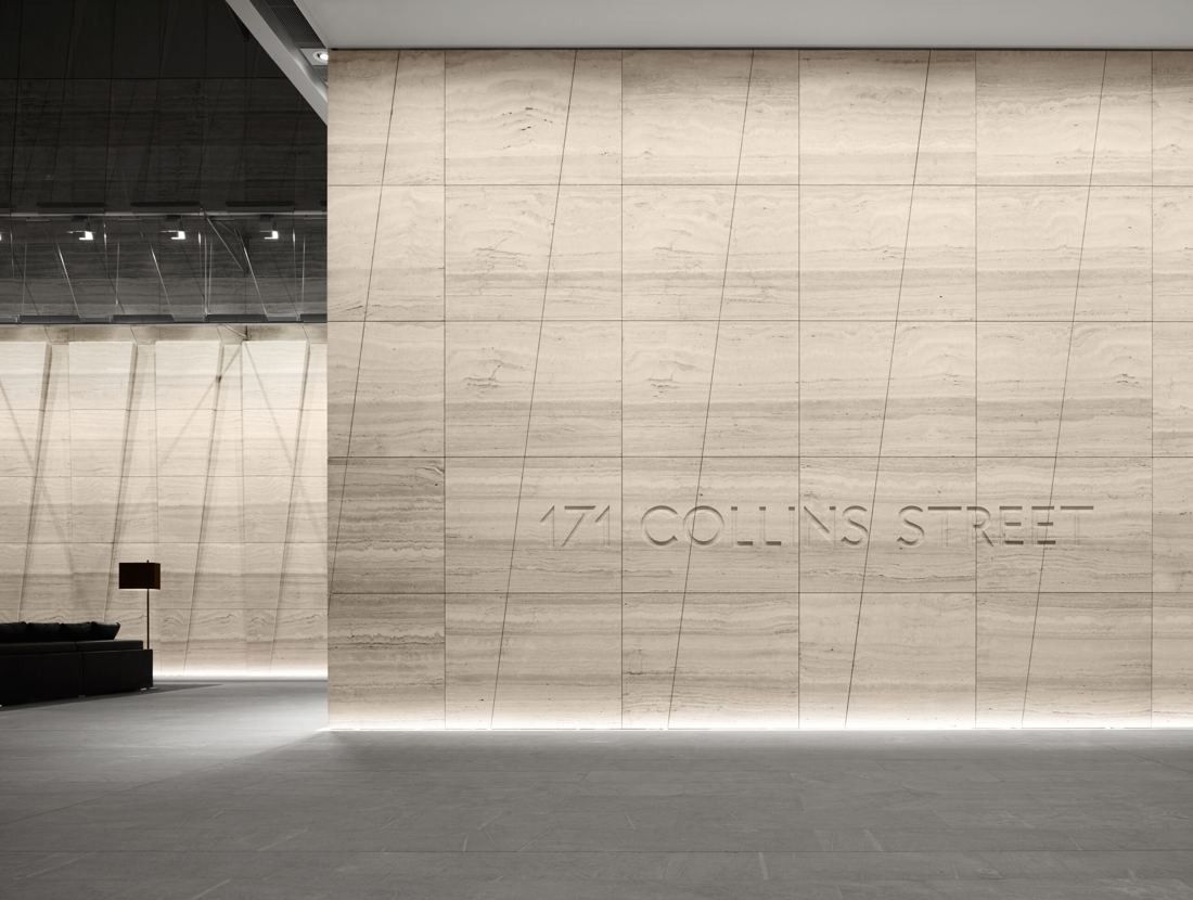 BHP: Lobby wall of pale stone panels with the building name 171 Collins Street