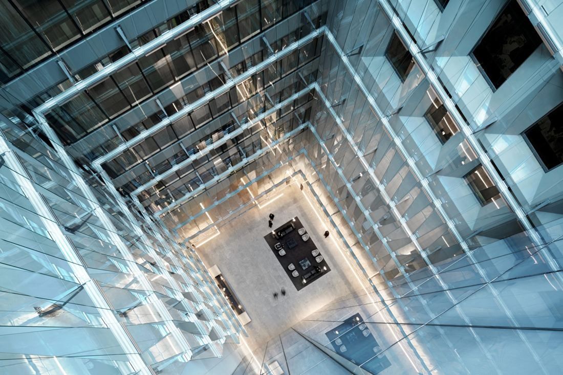 BHP: Looking up through a tall glass atrium framed by angled glazing