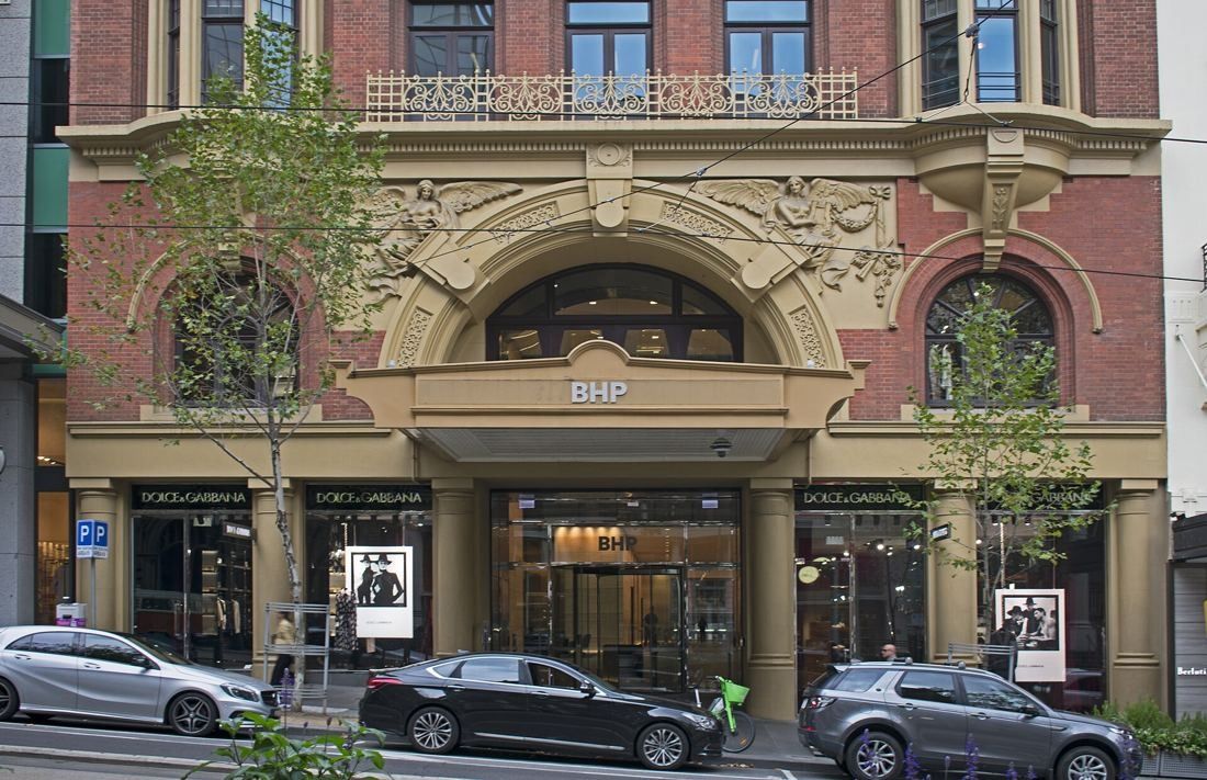 BHP: Ornate red-brick facade with an arched entrance marked BHP on Collins Street