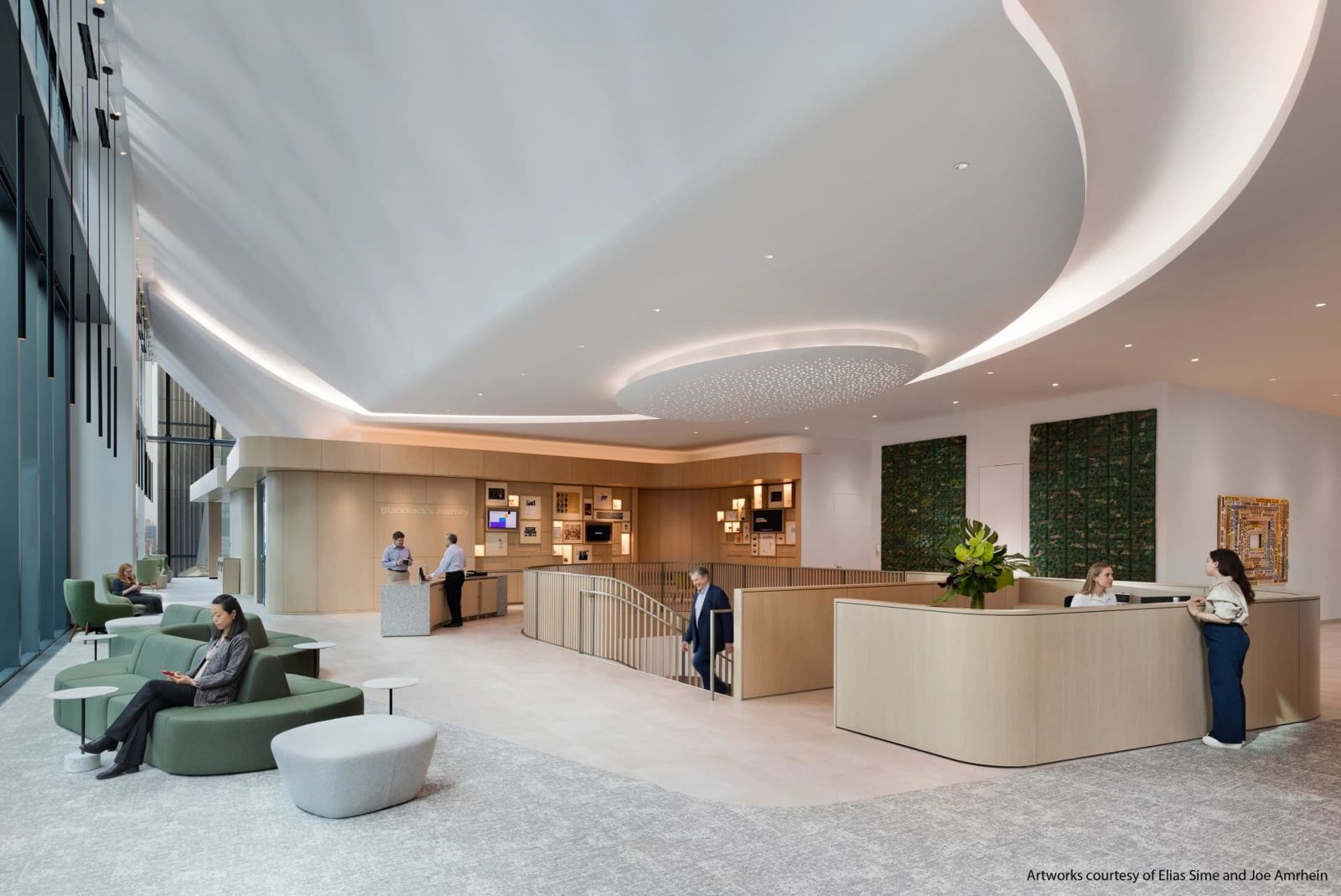 BlackRock: Reception with curved white ceiling, green walls and lounge seats