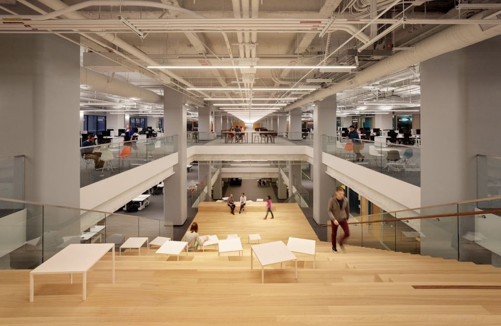 Block: A long timber stair hall between open floors
