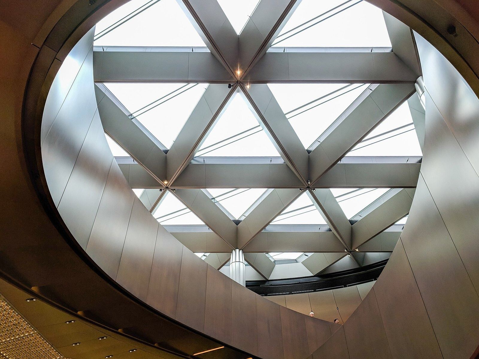 Bloomberg: A triangular skylight framed by a curved opening