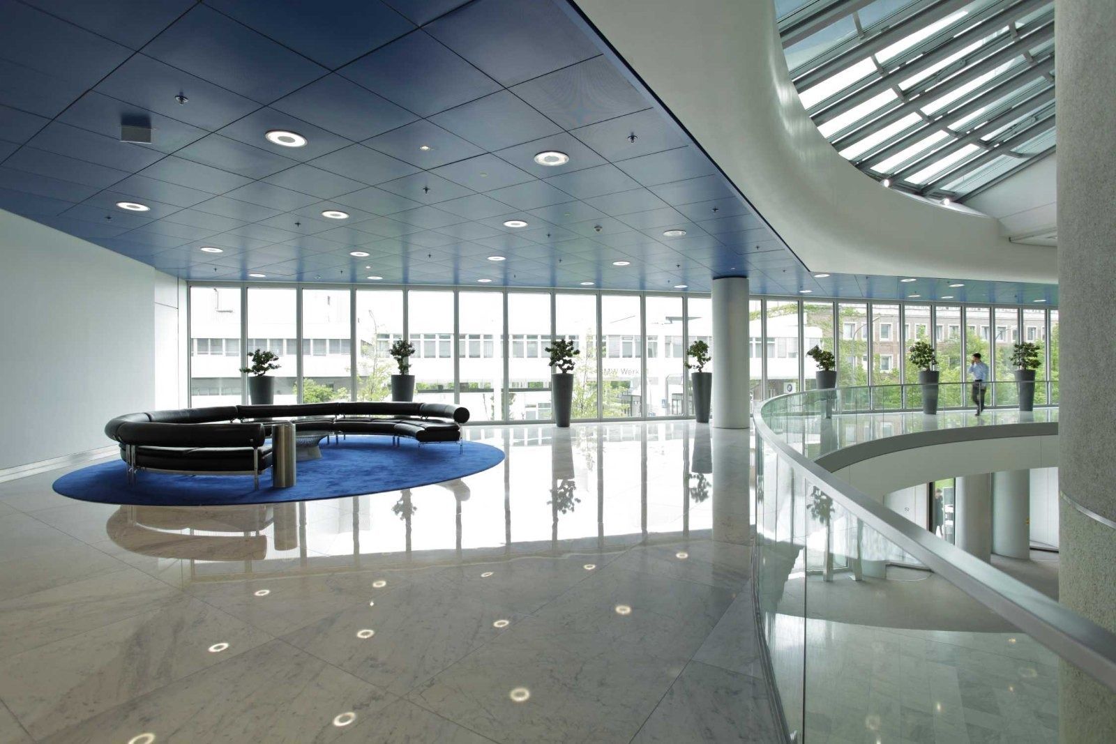 BMW Group: Bright foyer with a round blue bench
