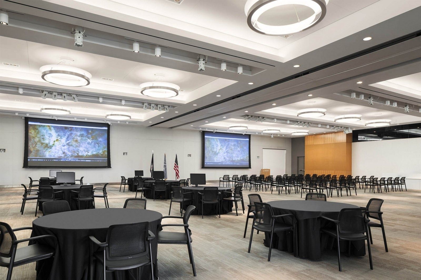Boeing: Conference center with round tables and screens