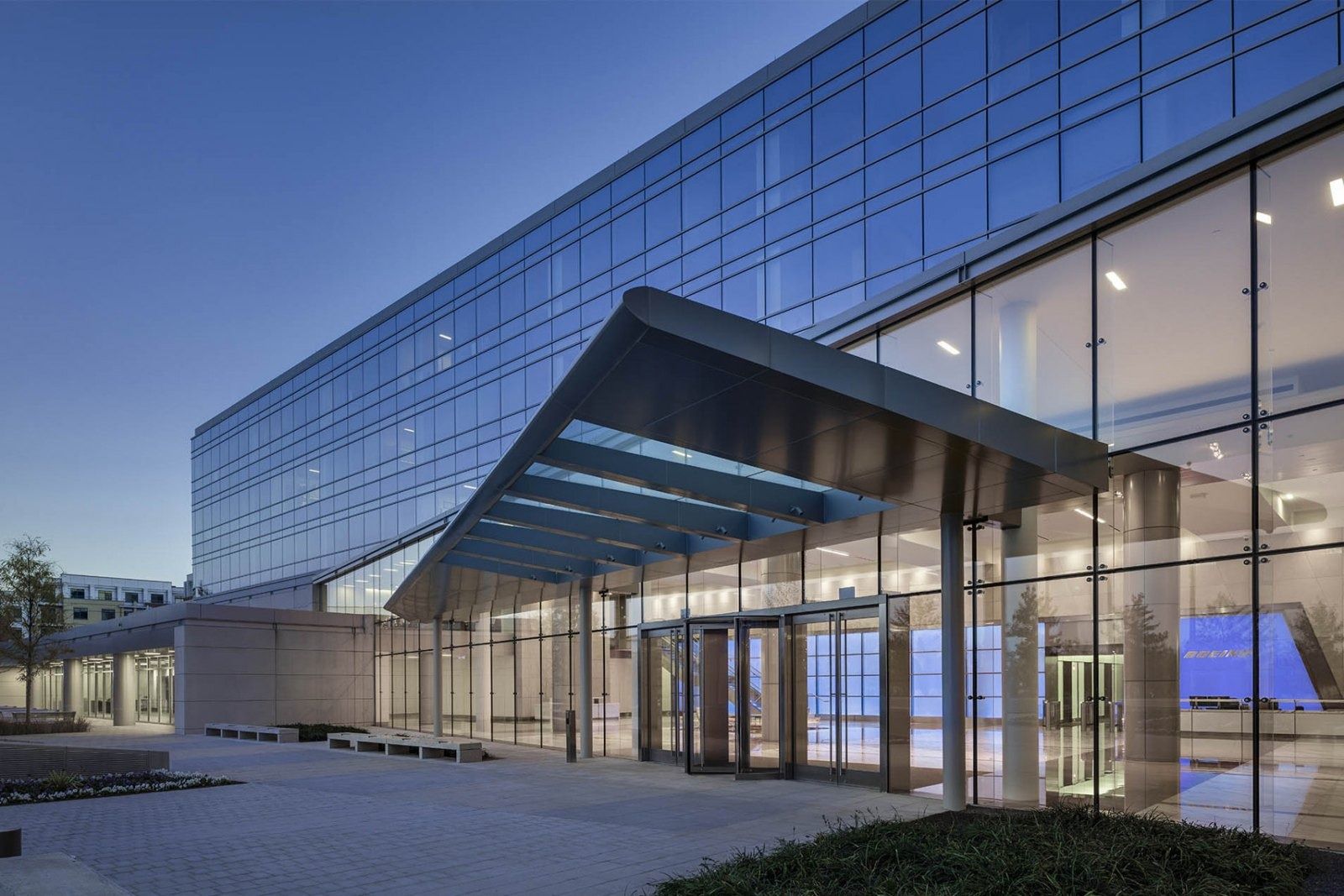 Boeing: Glass entrance canopy at dusk