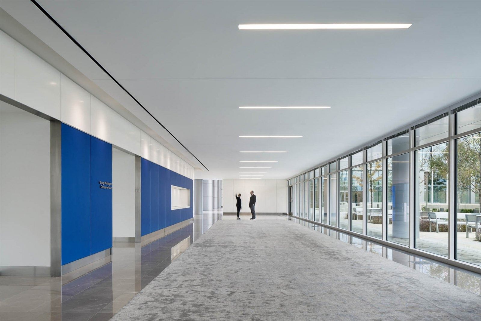 Boeing: Long glass corridor with blue panels