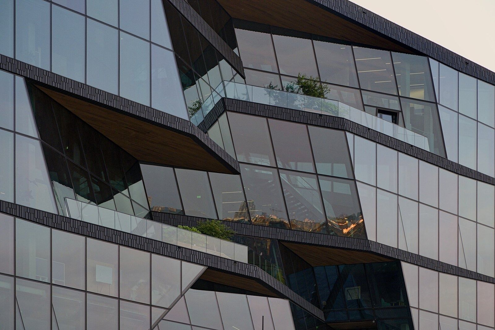 Booking Holdings: Detail of the angled glass facade with recessed terraces