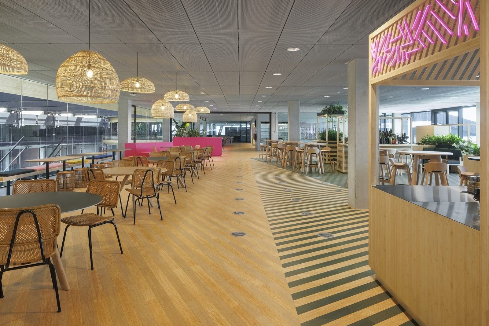 Booking Holdings: Dining area with rattan pendant lamps and kiosks