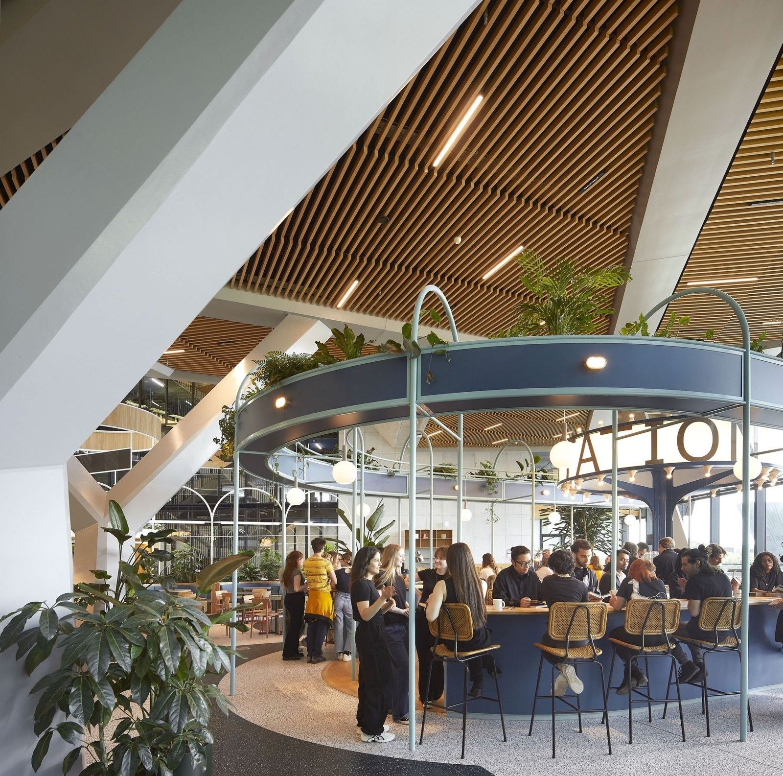 Booking Holdings: Round bar under a timber slatted ceiling