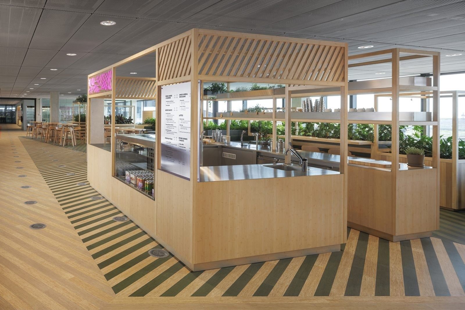 Booking Holdings: Timber food kiosk with green floor stripes