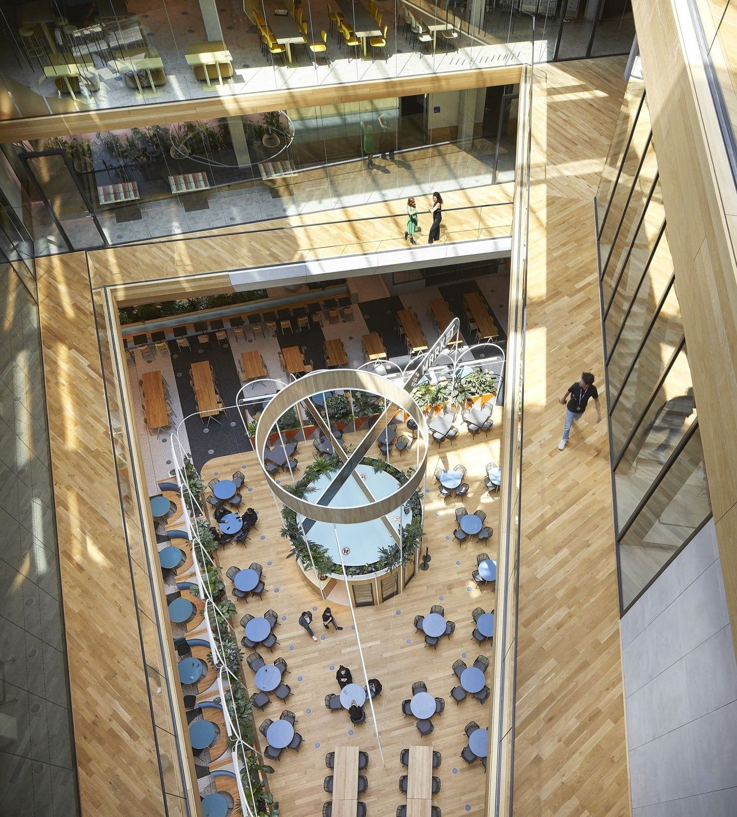 Booking Holdings: View straight down the atrium to a round bar and seating