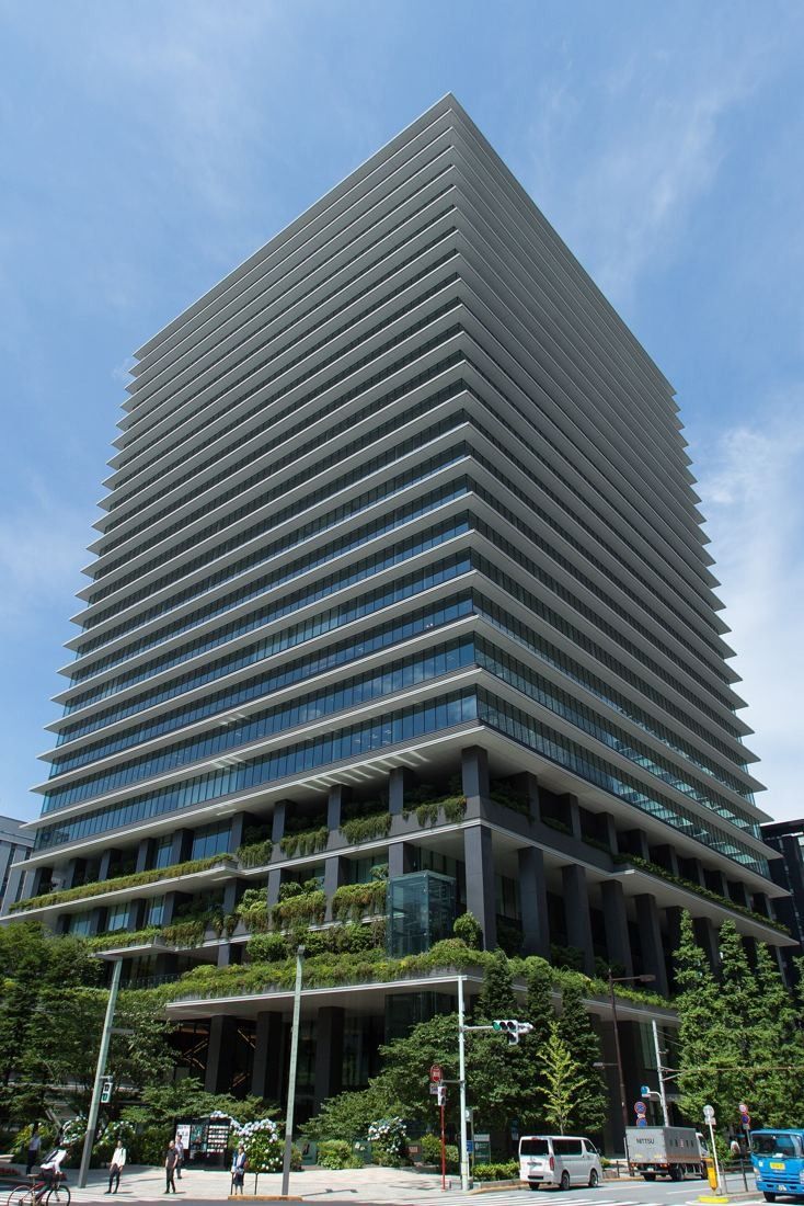 Bridgestone: The tower and its green lower terraces under a blue sky