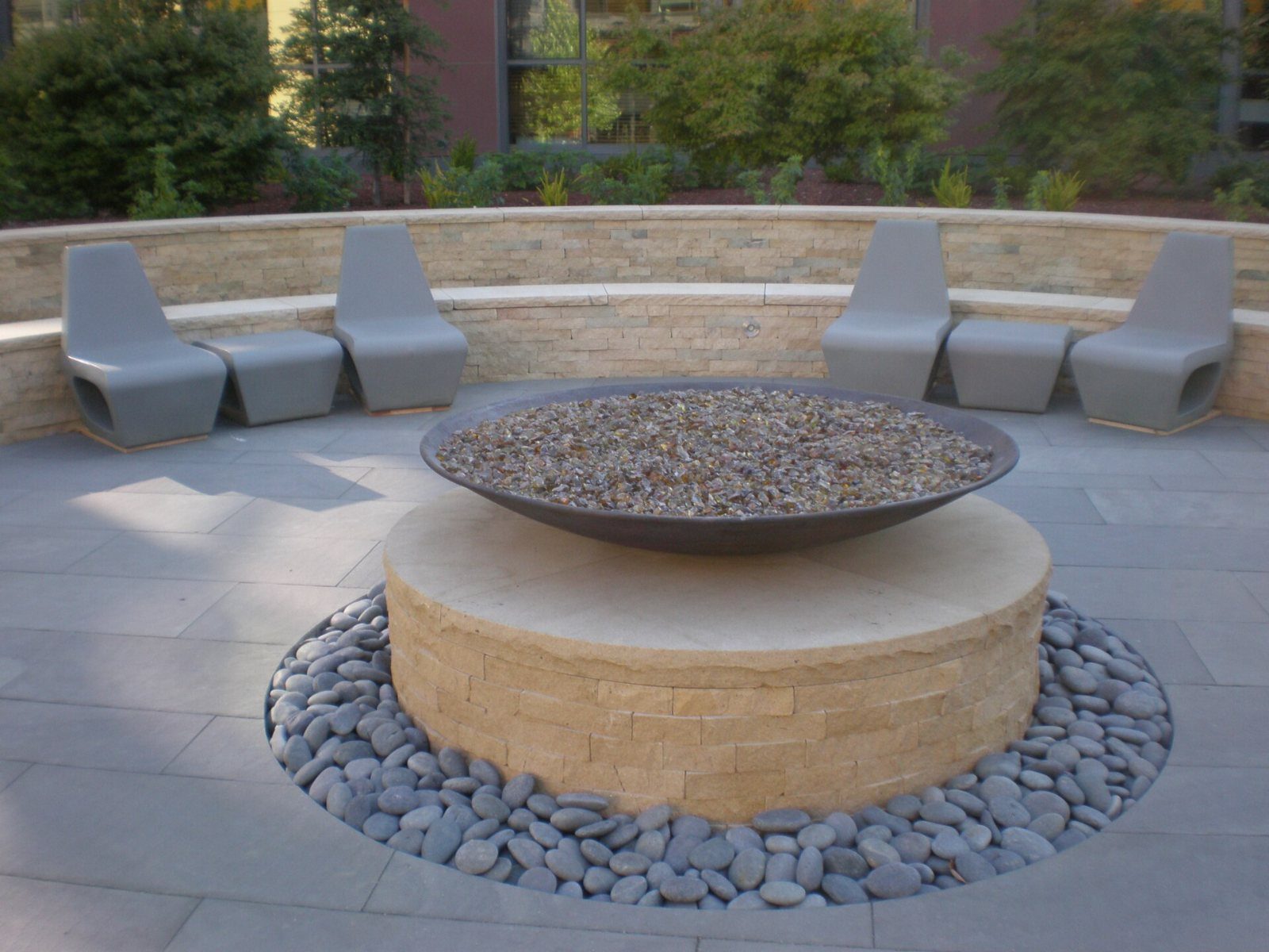 Fire pit surrounded by outdoor chairs