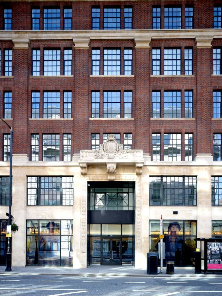 Burberry: Brick façade with a stone-framed double-height glazed entrance at street level