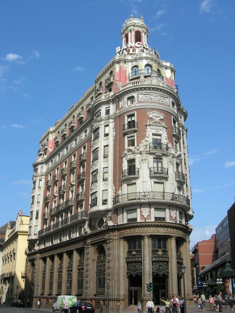 CaixaBank: The corner building with its domed lantern seen from across the street