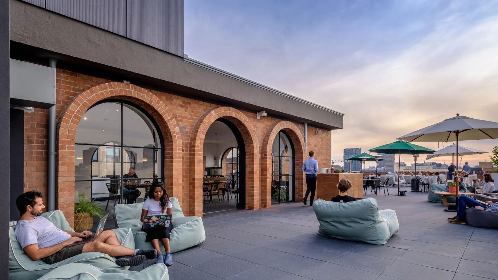 Canva: Brick arches and bean bags on the roof terrace