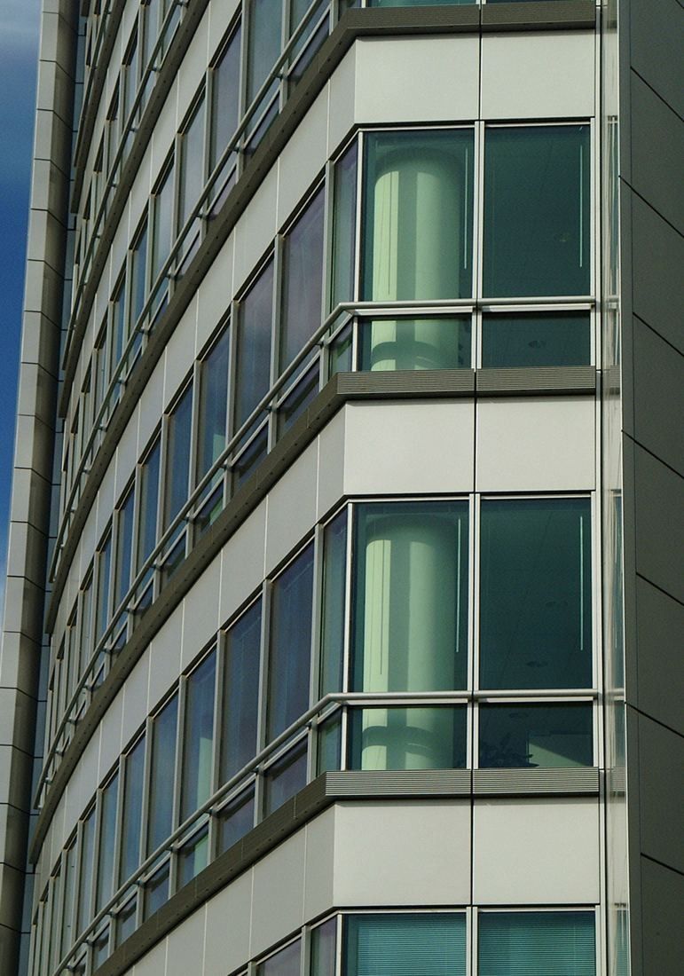 Capital One: Close view of a curved glass curtain wall
