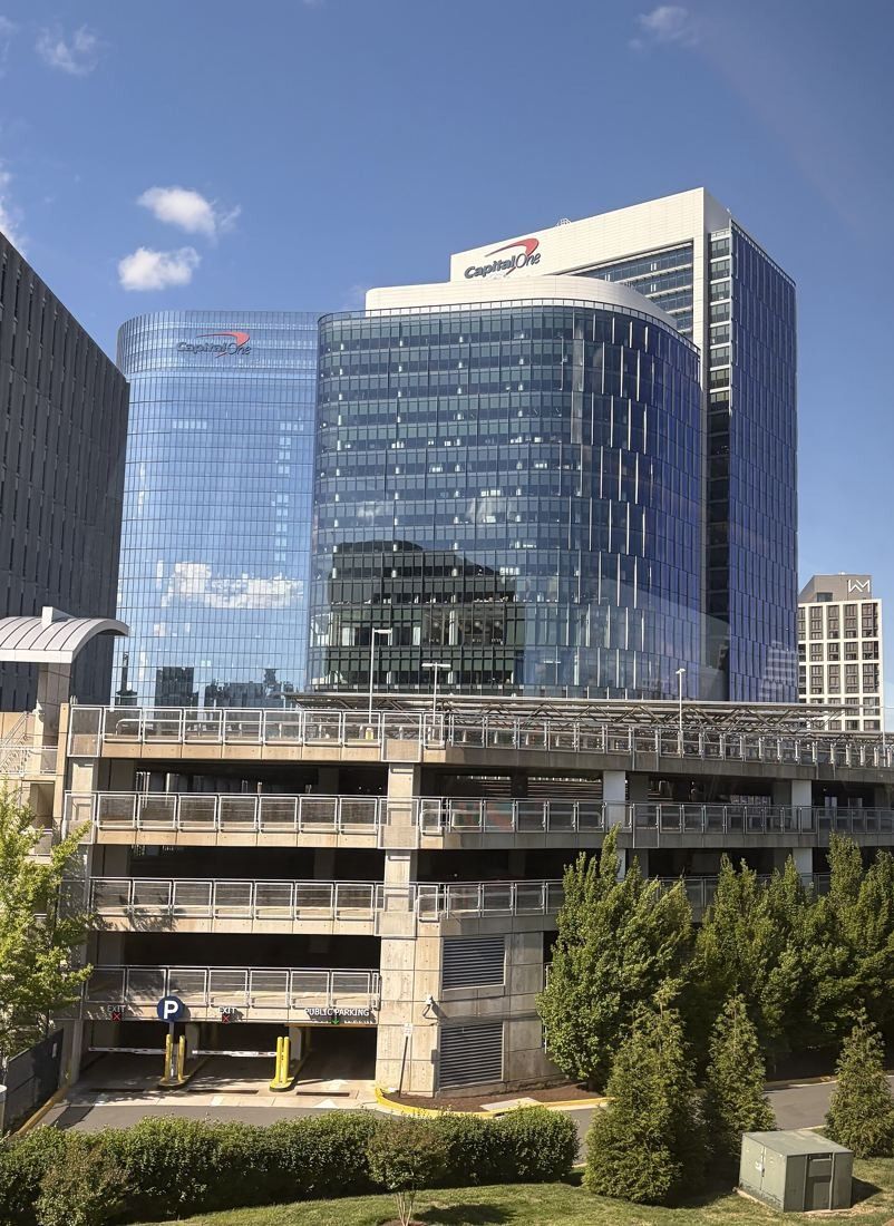 Capital One: Curved glass tower above a parking structure