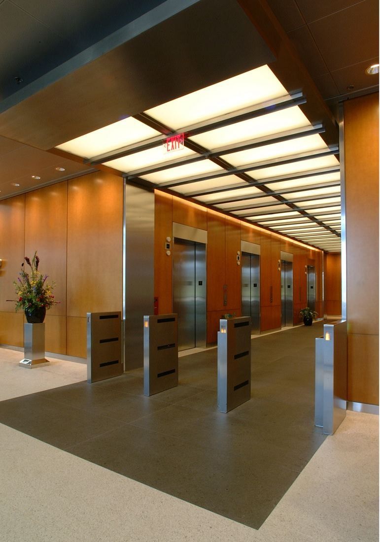Capital One: Elevator lobby with wood panels and a glowing ceiling