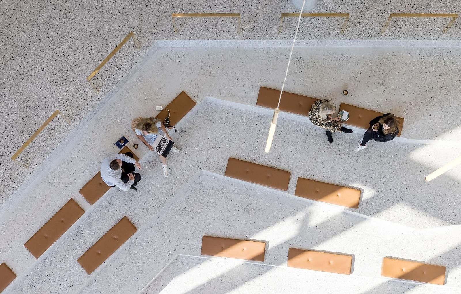 Carlsberg: Top-down view of terrazzo steps with leather seat pads and people sitting
