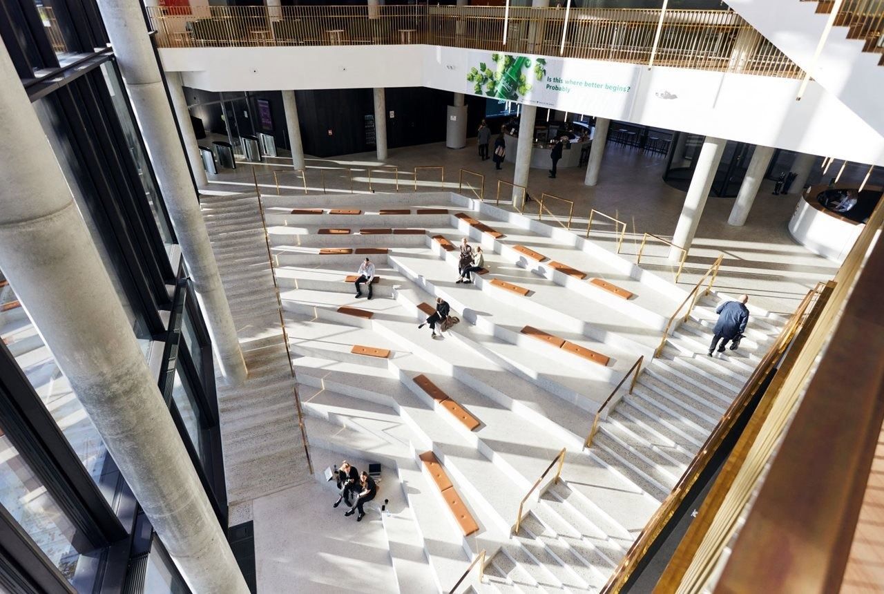 Carlsberg: View down onto the wide stepped staircase with seat pads in the atrium