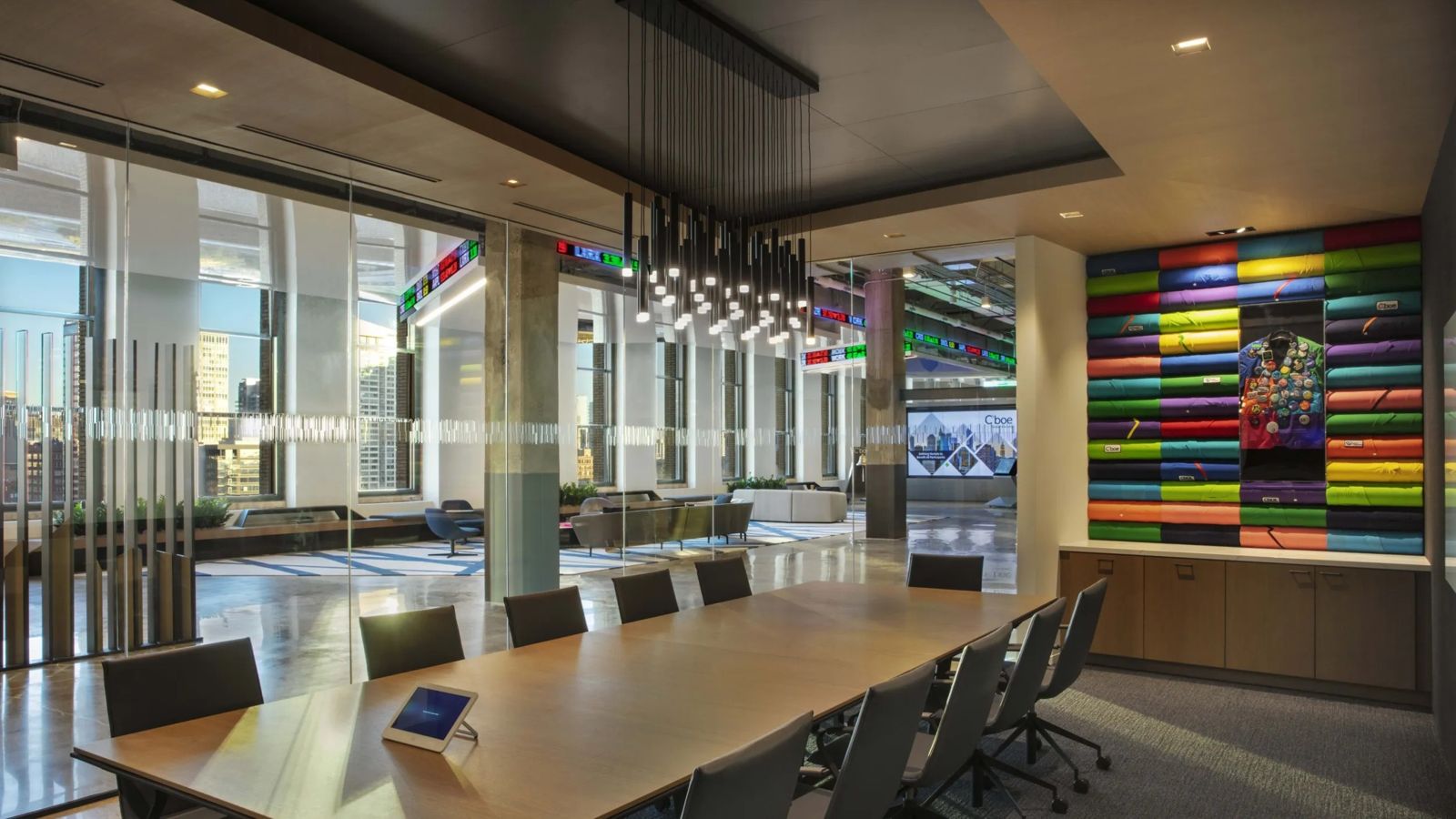 Cboe Global Markets: A boardroom with a long table, glass walls and a wall of colourful spools
