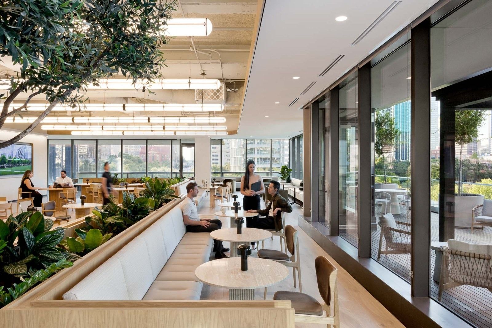 CBRE: Built-in seating among planters along a wall of windows
