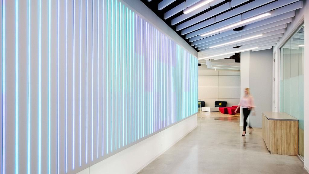 Cencora: A corridor lined with tall glowing glass panels