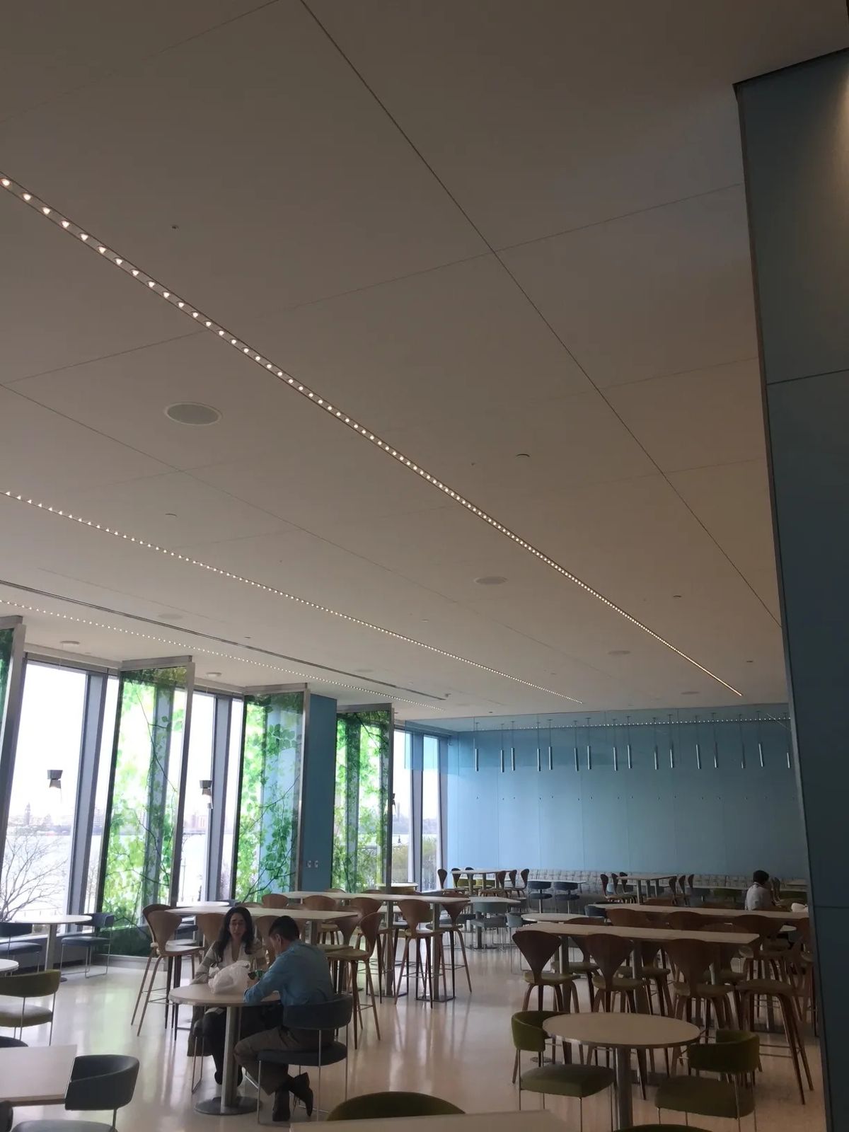 Citigroup: Cafeteria with tables beside tall windows