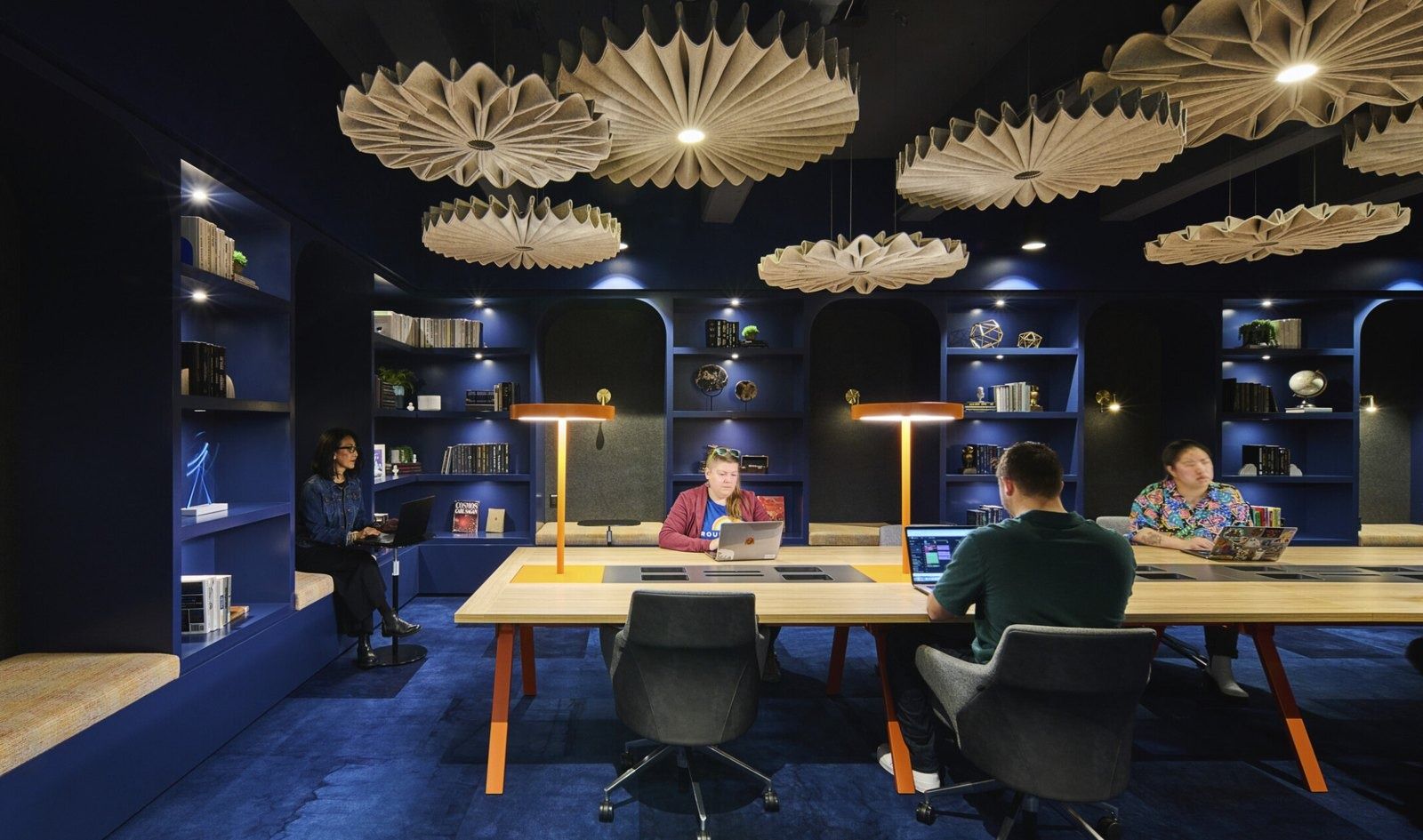 Cloudflare: A library work room under paper-fan pendants