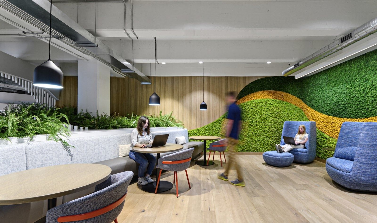 Cloudflare: A lounge with a moss wall and blue chairs
