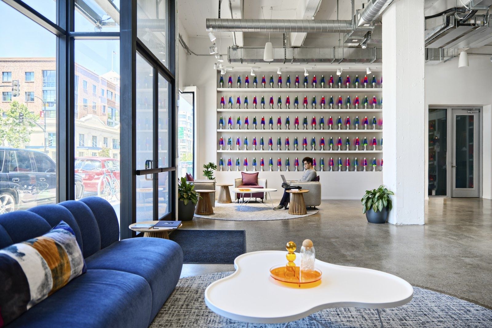 Cloudflare: Blue sofas in front of the lava lamp wall