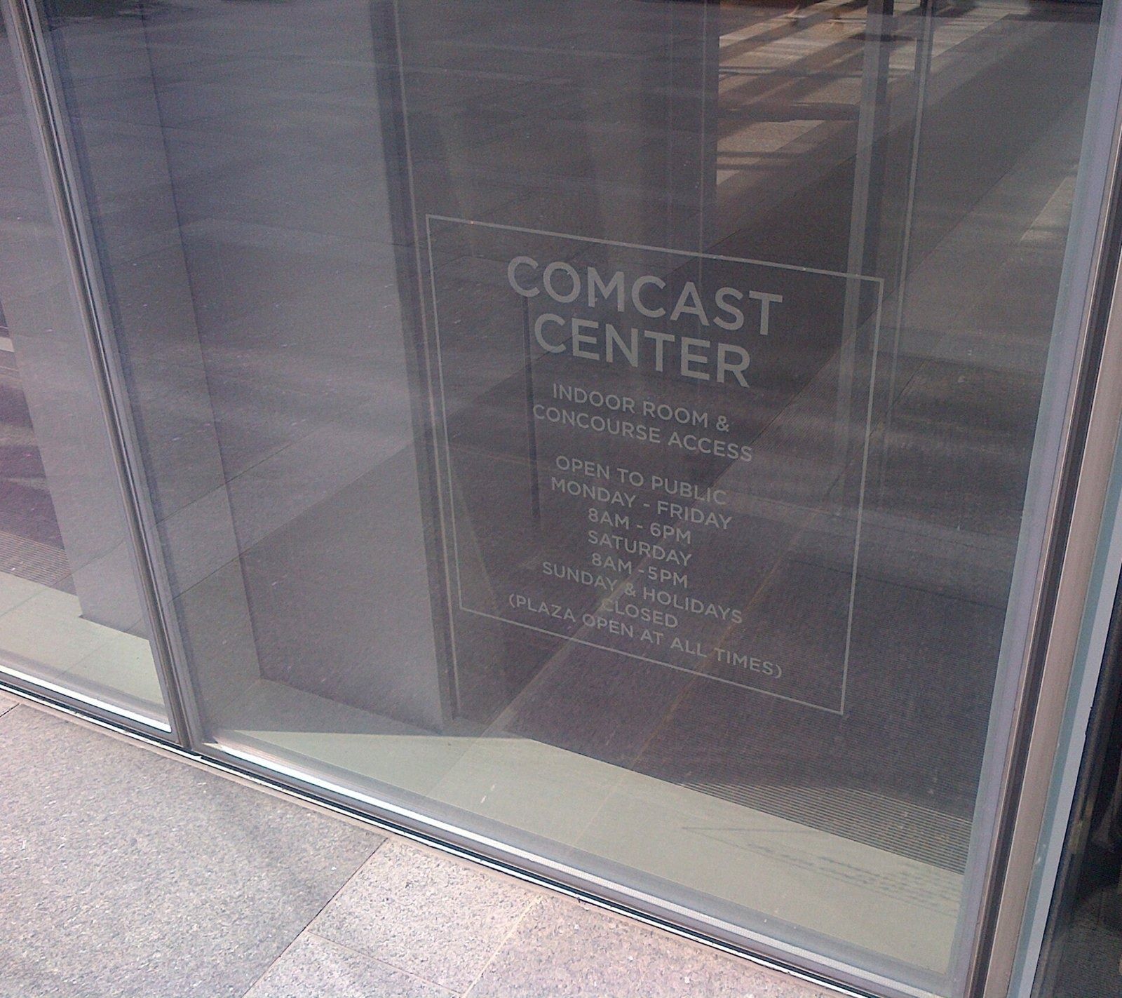 Comcast: Comcast Center lettering etched into a glass panel