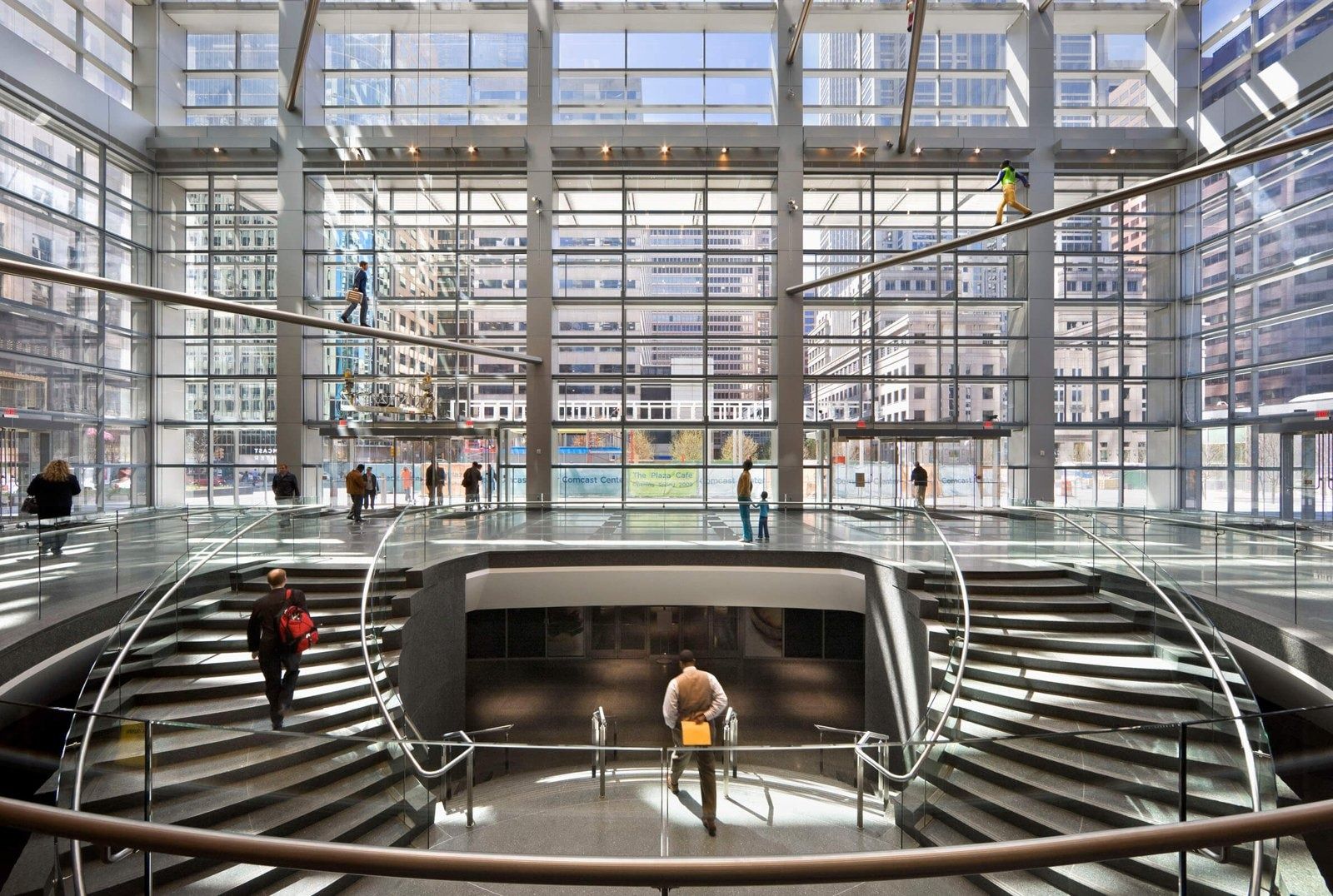 Comcast: Glass winter garden with a sweeping stair down to the concourse
