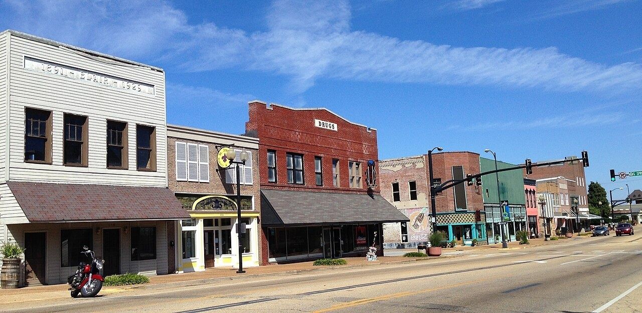 Low brick shopfronts on a street in downtown Tupelo