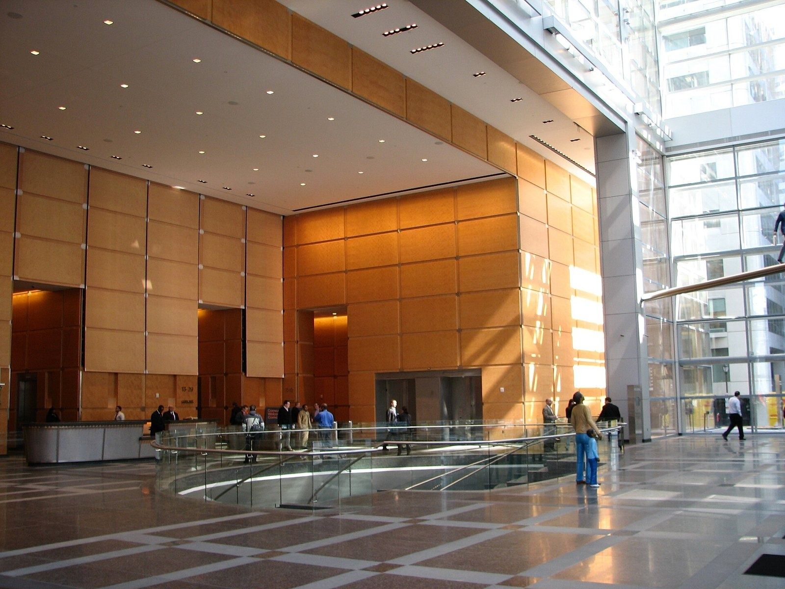 Comcast: Lobby with warm timber walls and a glass floor opening
