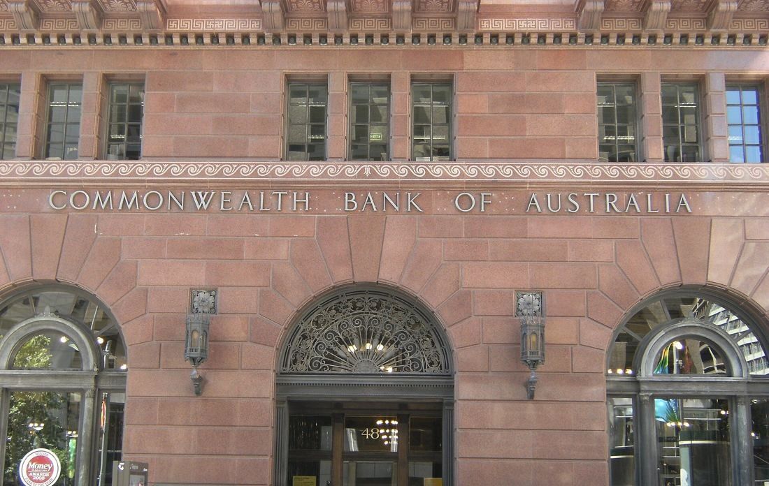 Red granite facade with arched doorways and the inscription Commonwealth Bank of Australia, door number 48