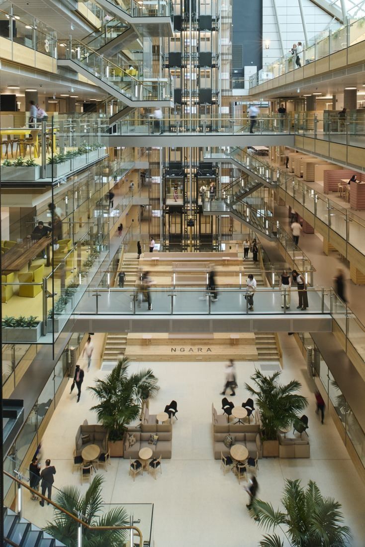 Commonwealth Bank of Australia: View down a tall atrium with stacked balconies, bridges and plants at the base