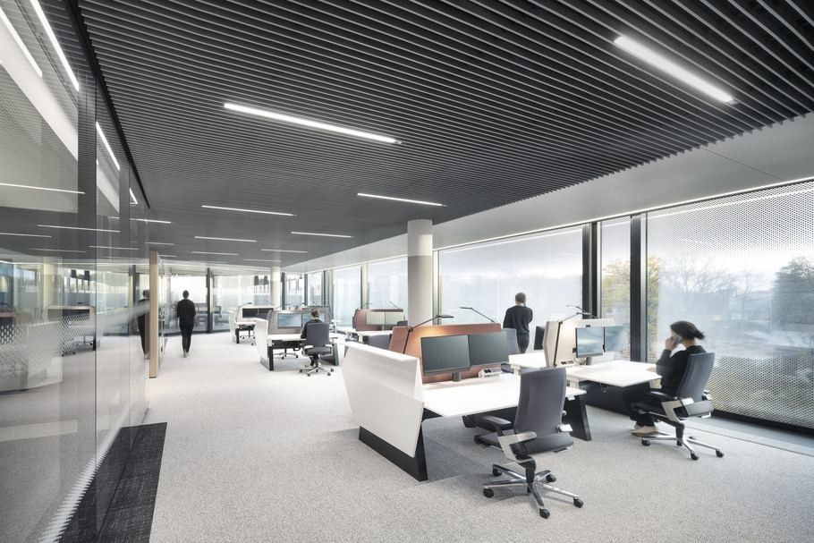 Continental: Open-plan office with desk clusters, dark slatted ceiling and full-height windows