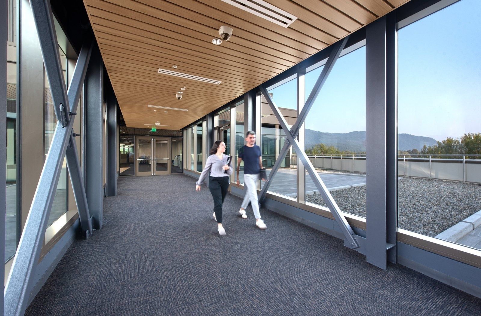 Costco Wholesale: A glazed sky bridge with mountain views