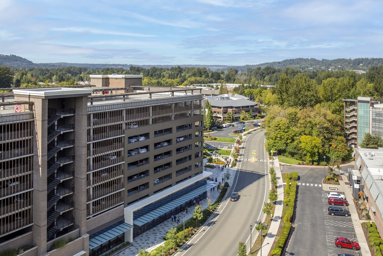 Costco Wholesale: A parking structure with campus buildings