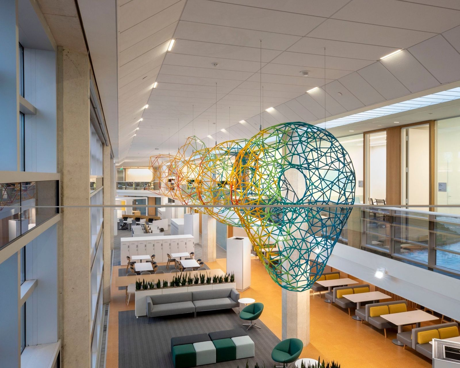 Cummins: Long atrium with lounges and wire sculptures