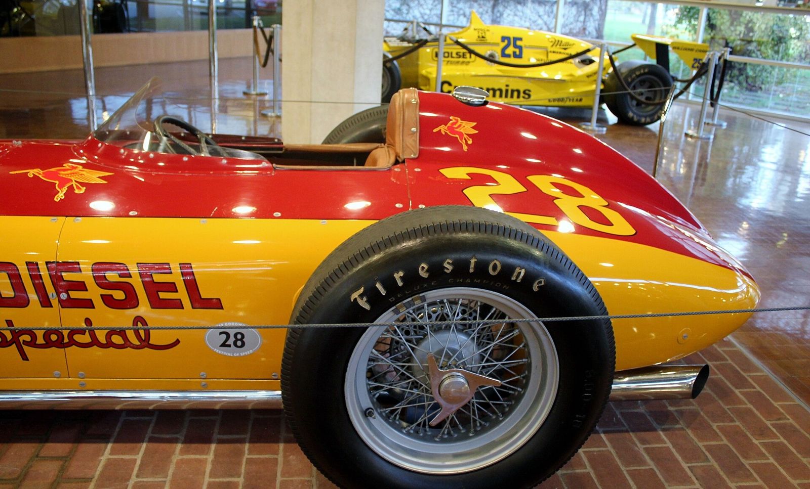 Cummins: Rear of a red and yellow vintage race car